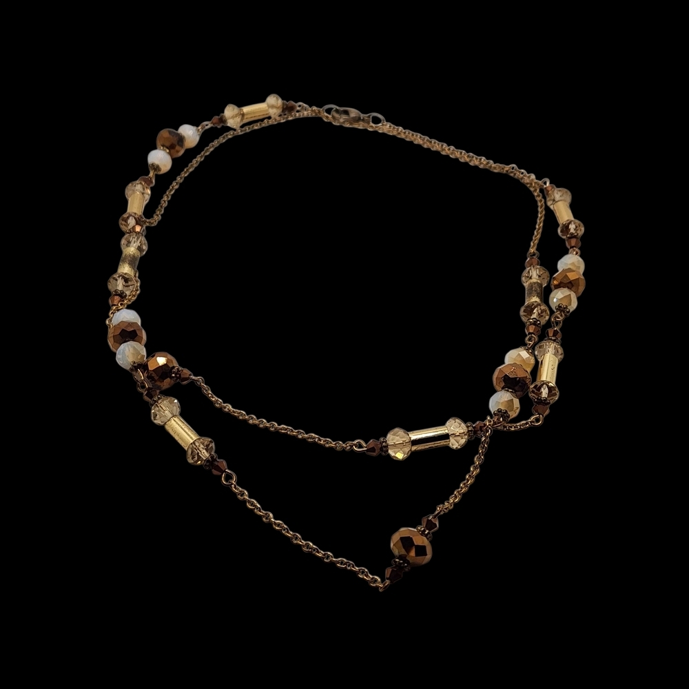 Women's Beaded Bugal Necklace On A Gold Tone Chain.